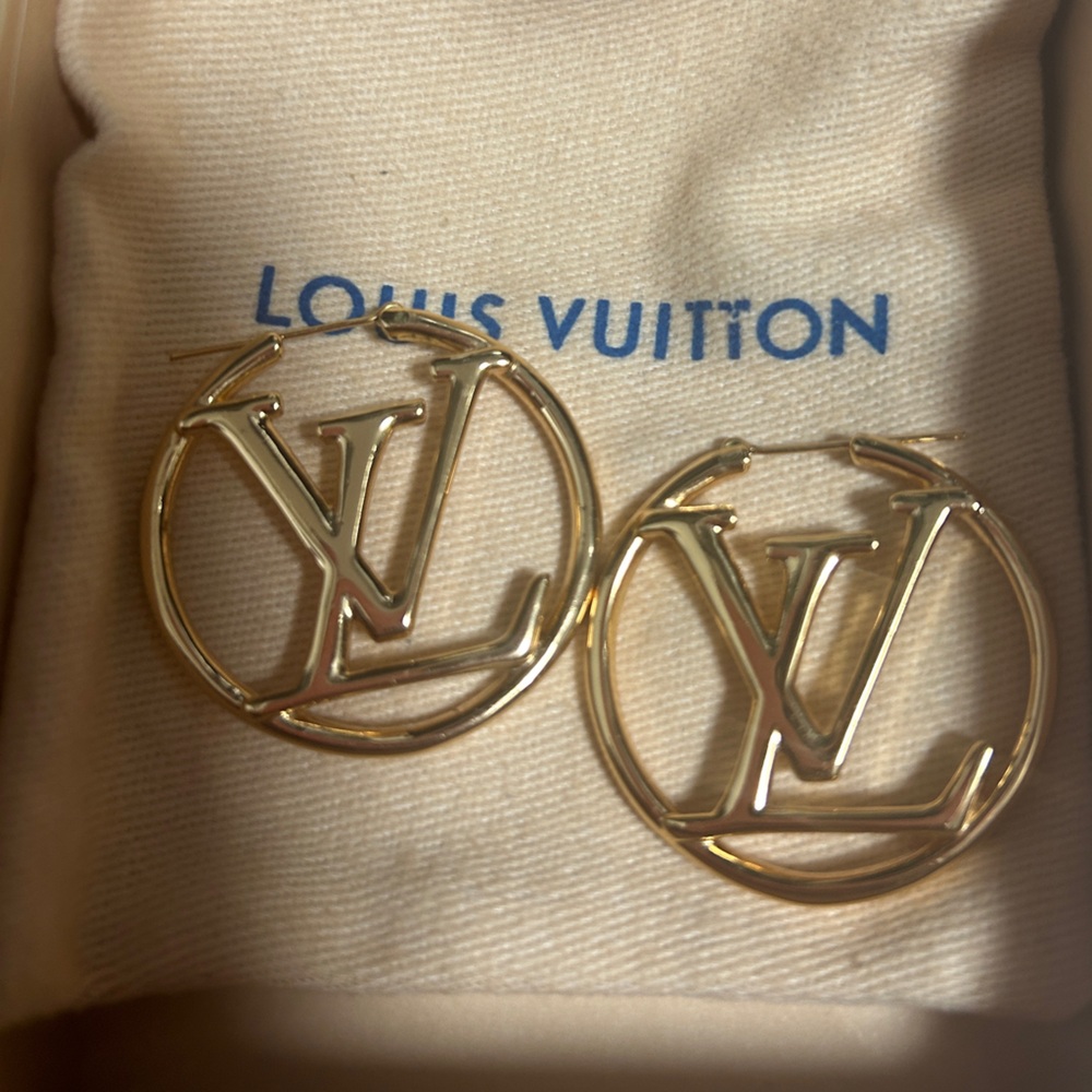 Woman’s gold earrings
